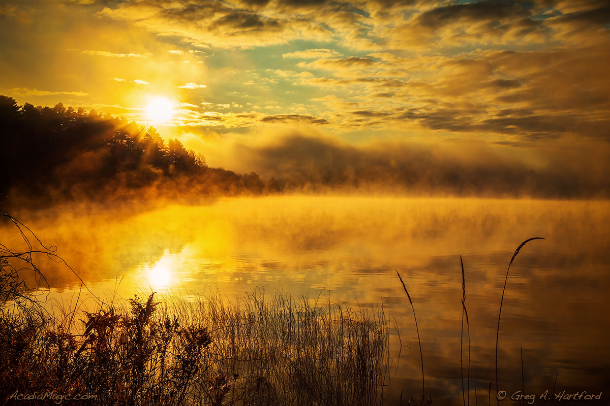 Thick fog at sunrise on Lake Wassookeag in Dexter, Maine
