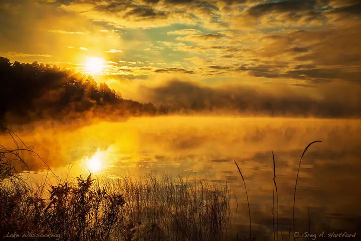 Glorious sunrise with fog on Lake Wassookeag, Dexter, Maine