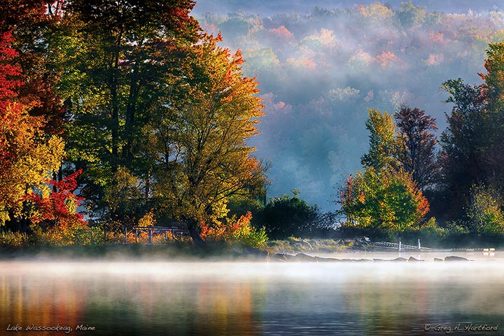 A morning mist floats over the water in October on Little Lake Wassookeag.