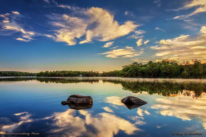 Clouds reflected in Lake Wassookeag at sunrise